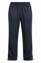 Load image into Gallery viewer, A pair of dark navy blue sweatpants with an elastic waistband and a small black logo on the left thigh, shown against a plain white background.
