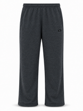 Load image into Gallery viewer, Dark heather gray sweatpants with an elastic waistband and a small black circular logo on the left hip, shown against a plain white background.