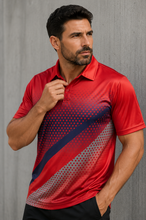 Load image into Gallery viewer, A man wearing a red short-sleeve polo shirt with a diagonal gradient pattern in navy blue and gray, posed against a textured gray wall.
