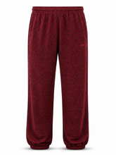 Load image into Gallery viewer, A pair of heathered burgundy fleece sweatpants with an elastic waistband and cuffed ankles, featuring a small red logo on the left hip.
