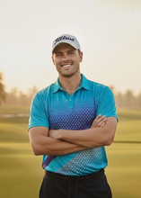 Load image into Gallery viewer, Golfer in a blue shirt and cap standing on a golf course with palm trees in the background
